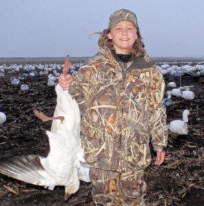 Although a little too young to carry a gun this young hunter enjoyed retrieving our snow geese.