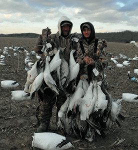 Here Up North Outdoors Guide Jim Weston (left) poses for a picture with one of his snow goose hunters.