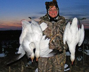 One of our many female hunters with some of the snow geese she harvested.