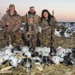 Nothing but smiles for these young hunters as the pose for a picture with their guide Mark Orton.