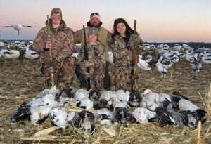 Nothing but smiles for these young hunters as the pose for a picture with their guide Mark Orton.